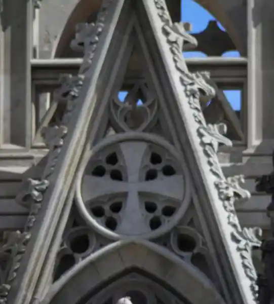 A cross inside a circle and a crescent on top at the Cathedral of Barcelona
